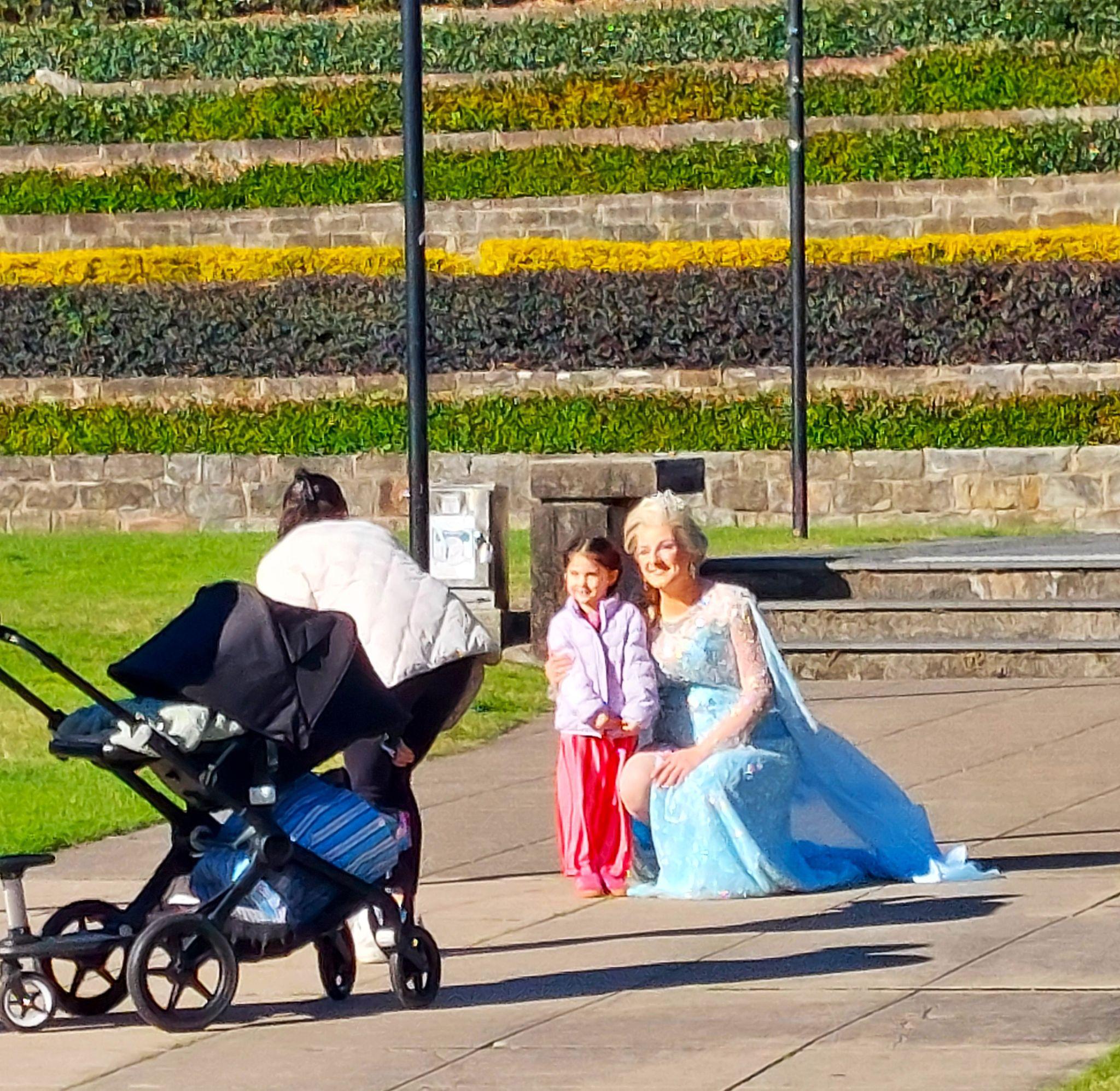 Elsa stops for a photograph with a young fan during the Newcastle trailer shoot
